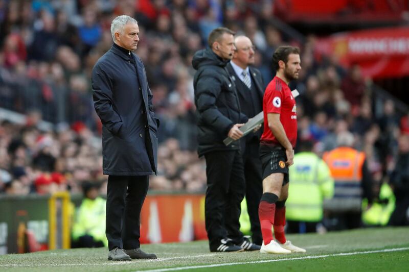 Manchester United manager Jose Mourinho, left, prepares to bring on substitute Juan Mata after seeing his side go 2-0 down to Newcastle United at Old Trafford. Reuters