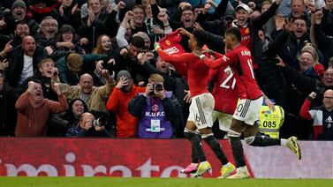 Manchester United's Amad Diallo, left, celebrates after scoring his side's late winner against Liverpool. AP