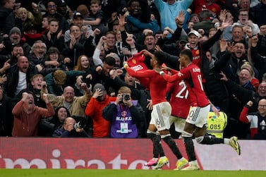 Manchester United's Amad Diallo, left, celebrates after scoring his side's fourth goal during the FA Cup quarterfinal soccer match between Manchester United and Liverpool at the Old Trafford stadium in Manchester, England, Sunday, March 17, 2024.  (AP Photo / Dave Thompson)