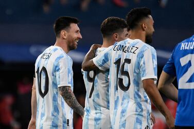 Argentina's Lionel Messi (L) celebrates with teammates after scoring his team's fifth goal during the international friendly football match between Argentina and Estonia at El Sadar stadium in Pamplona on June 5, 2022.  (Photo by ANDER GILLENEA  /  AFP)