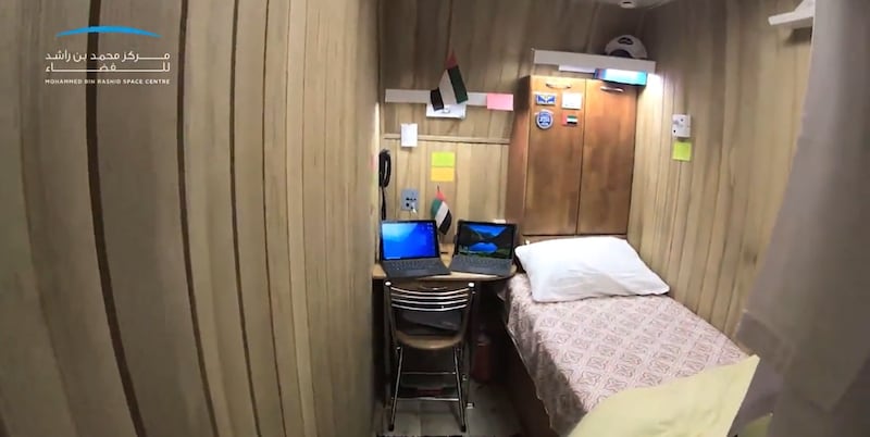 Mr Al Ameri's room in the complex. Each participant has a similar small space for privacy, while a small living room allows them to socialise and watch television. Each bedroom has a bed, desk and cupboard.