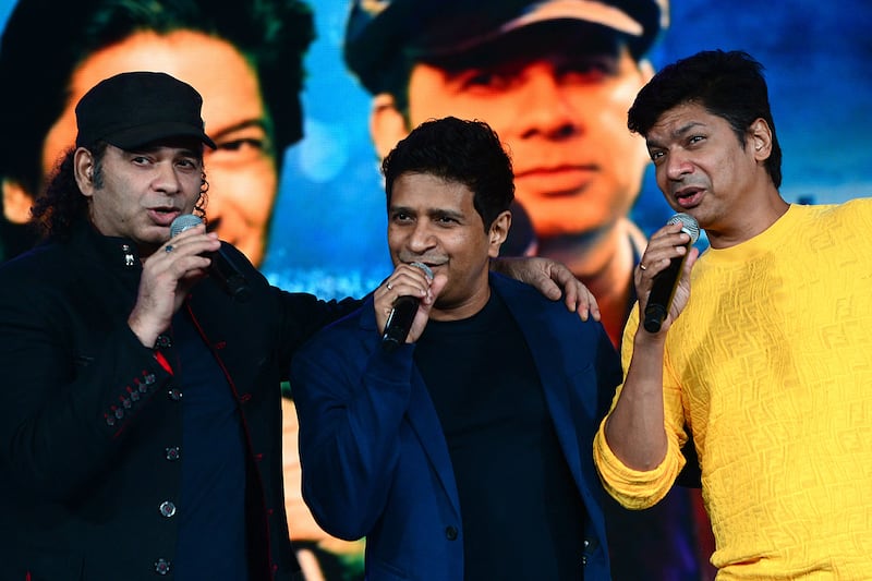 Bollywood singers Mohit Chauhan, left, KK, centre and Shaan  at a concert on Mumbai on September 27, 2021. AFP