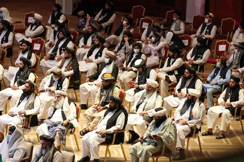 Members of the Taliban delegation attend the opening session of the peace talks with the Afghan government in Doha. AFP