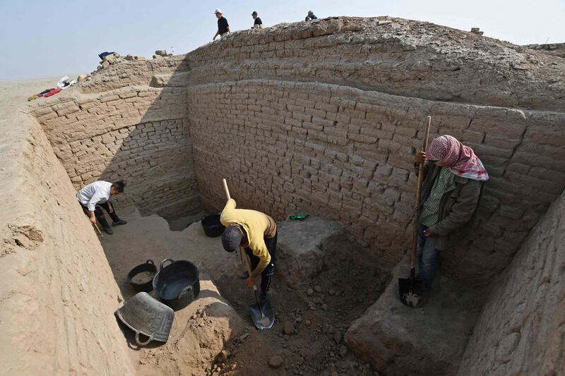 Workers excavate the site of the Sumerian city-state of Larsa, in the Qatiaah area of Iraq's southern province of Dhi Qar.