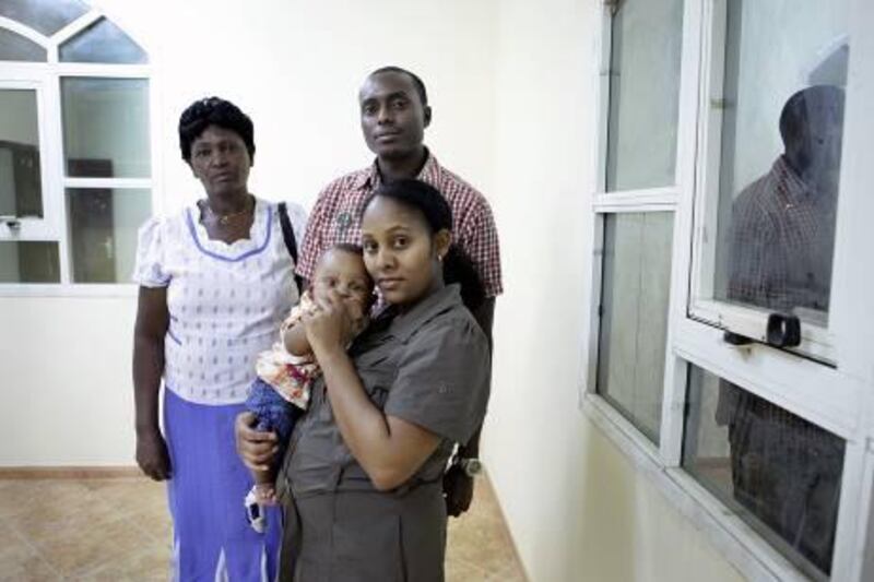 ABU DHABI, UNITED ARAB EMIRATES -  October 19, 2011 -  Peter Macharia and his family, his mother Florence Macharia, his wife Cecilia Waigwe and son Shawn Kihato Macharia, are the victims of a real estate agent scam that lost them Dh45,000 after they were not able to move into a villa they had a contract on.    ( DELORES JOHNSON / The National )