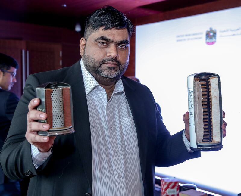 Kamran Sarwar, Al-Futtaim Automotive Brands protection manager with samples of fake oil filters. 