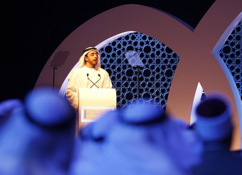 The Minister of Foreign Affairs, Sheikh Abdullah bin Zayed, addresses academics and religious leaders at the opening session of the Promoting Peace in Muslim Societies conference yesterday in Abu Dhabi, which discussed how to reduce conflict in the Muslim world and beyond. Karim Sahib / AFP
