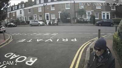 CCTV footage of Anis Fouad Hemissi, wearing a latex mask and sunglasses on the junction of Battersea Church Road and Paveley Driveon. PA