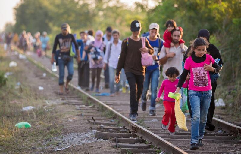 Migrants cross the border between Serbia and Hungary. According to the Hungarian authorities, a record number of migrants from many parts of the Middle East, Africa and Asia crossed the border from Serbia earlier this week. Matt Cardy / Getty Images