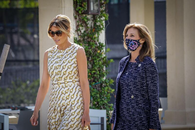 After voting, First Lady Melania Trump, left, leaves the Morton and Barbara Mandel Recreation Centre with the Palm Beach County Supervisor of Elections Wendy Sartory Link in Palm Beach, Florida on November, 3, 2020.  AFP