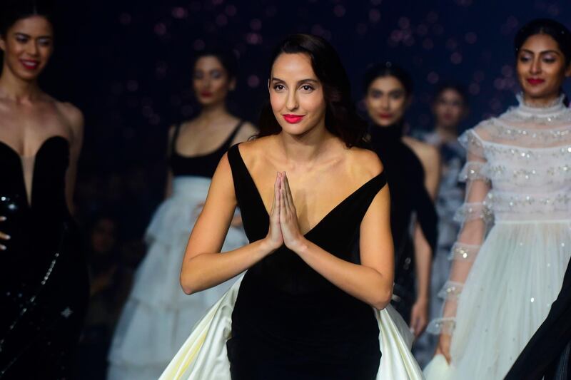 Nora Fatehi showcases a creation by designer Gauri and Nainika during Lakme Fashion Week in Mumbai.  AFP