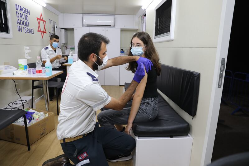 A minor receives a Covid-19 vaccine at a vaccination station in Tel Aviv, Israel.