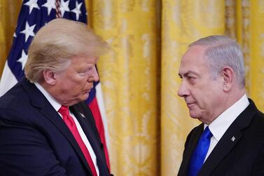 TOPSHOT - US President Donald Trump and Israel's Prime Minister Benjamin Netanyahu take part in an announcement of Trump's Middle East peace plan in the East Room of the White House in Washington, DC on January 28, 2020. Trump declared that Israel was taking a "big step towards peace" as he unveiled a plan aimed at solving the Israeli-Palestinian conflict. "Today, Israel takes a big step towards peace," Trump said, standing alongside Netanyahu as he revealed details of the plan already emphatically rejected by the Palestinians. / AFP / MANDEL NGAN