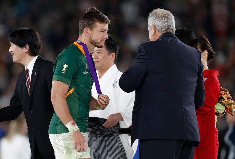 South Africa fly-half Handre Pollard walks up to receive his winners medal. Reuters