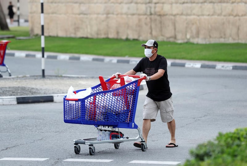 Dubai, United Arab Emirates - Reporter: N/A: People shop for their essential supplies at Carrefour, Ibn Battuta due to the corona outbreak. Sunday, April 12th, 2020. Dubai. Chris Whiteoak / The National