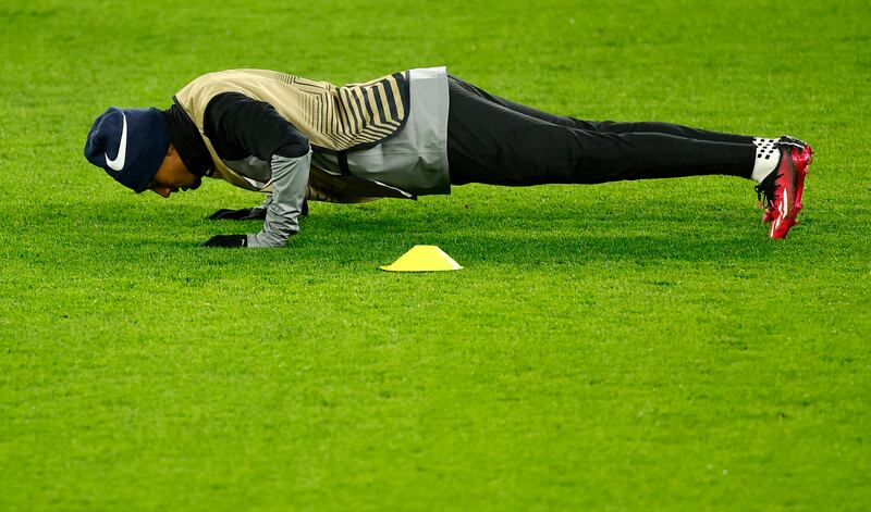 Barcelona's Raphinha does push-ups. Reuters