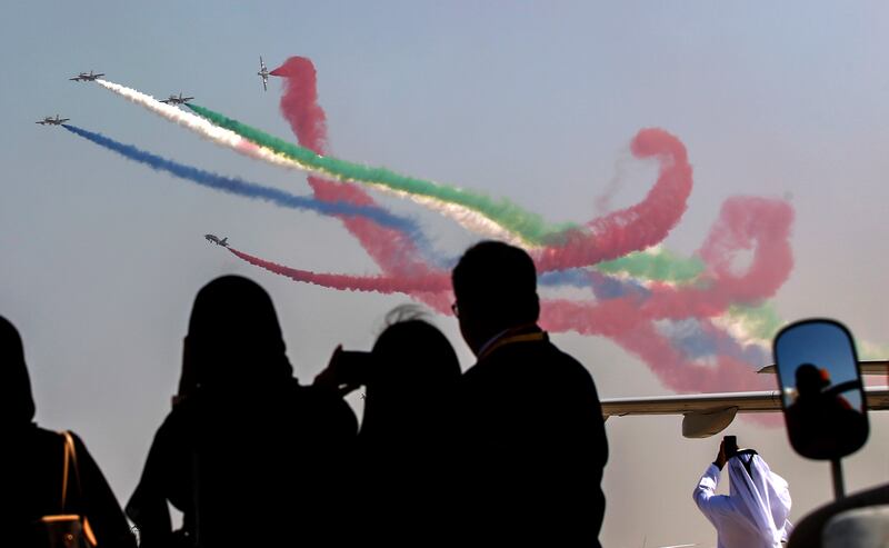 Members of Al Fursan aerobatics demonstration team of the UAE perform during the Abu Dhabi Air Expo 2022 at Al Bateen Executive Airport. EPA