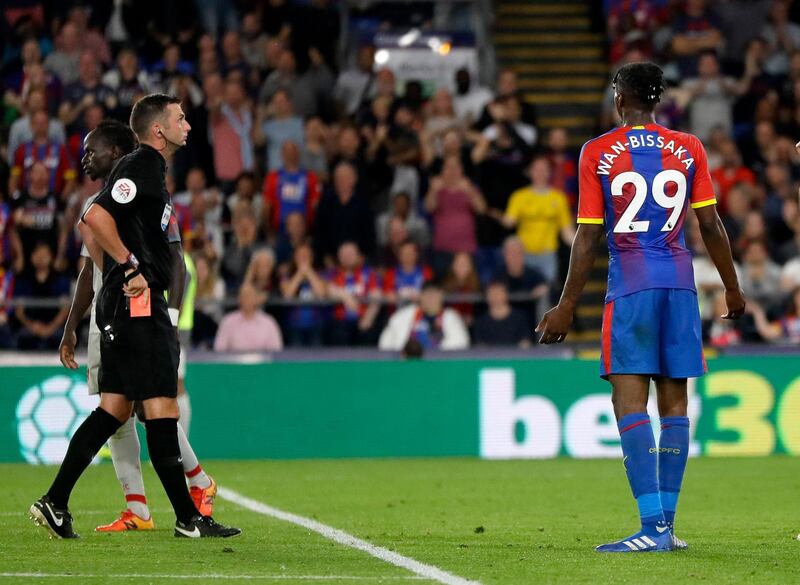 Aaron Wan-Bissaka, recieves a red card fro his foul on Mohamed Salah. AP Photo