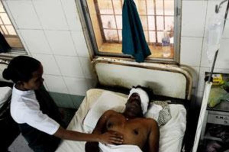 An injured police officer rests in hospita after the Maoist attack that killed 76 of his colleagues in Chhattisgarh state, India, on Tuesday.