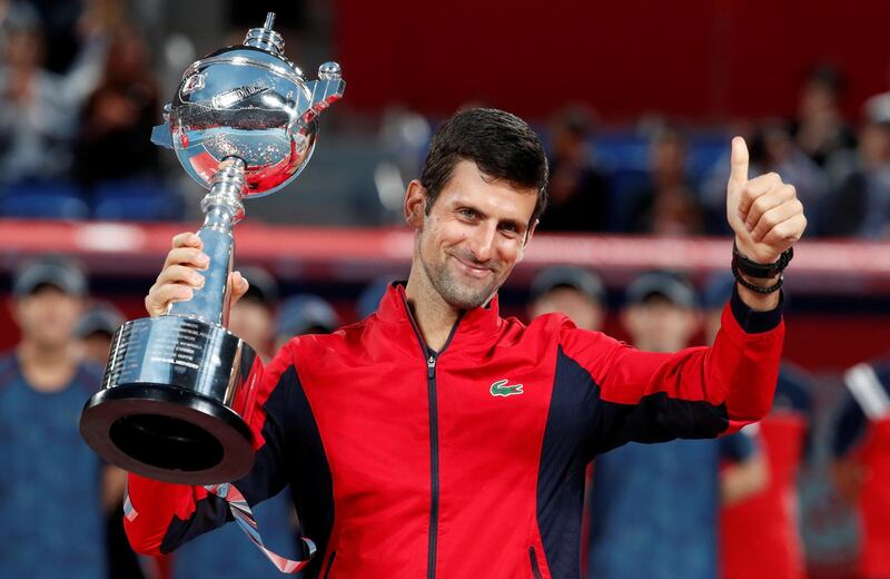 Tennis - Japan Open - Men's Singles finals - Ariake Coliseum, Tokyo, Japan - October 6, 2019. Novak Djokovic of Serbia celebrates with the trophy after winning. REUTERS/Kim Kyung-Hoon