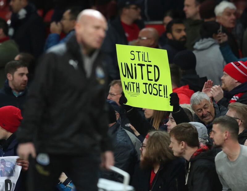 Fans show their support for Jose Mourinho. AP Photo