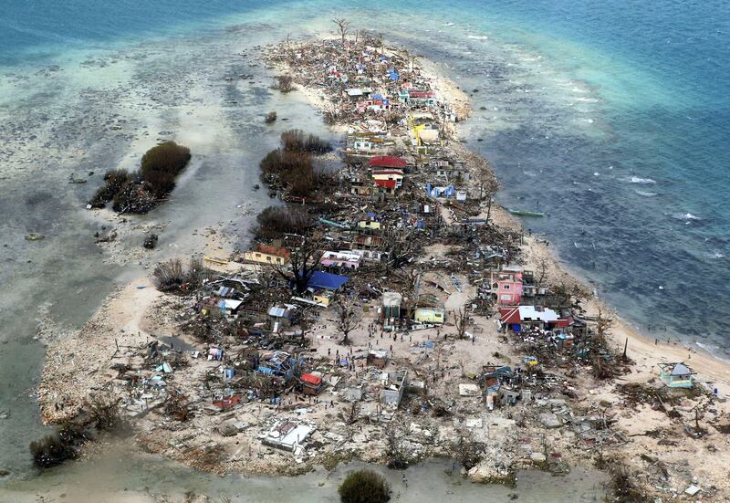 An aerial view of a coastal town devastated by super Typhoon Haiyan in Samar province, Philippines, November 11, 2013. Picture taken November 11, 2013. REUTERS/Erik De Castro/File Photo   SEARCH "POY DECADE" FOR THIS STORY. SEARCH "REUTERS POY" FOR ALL BEST OF 2019 PACKAGES. TPX IMAGES OF THE DAY.