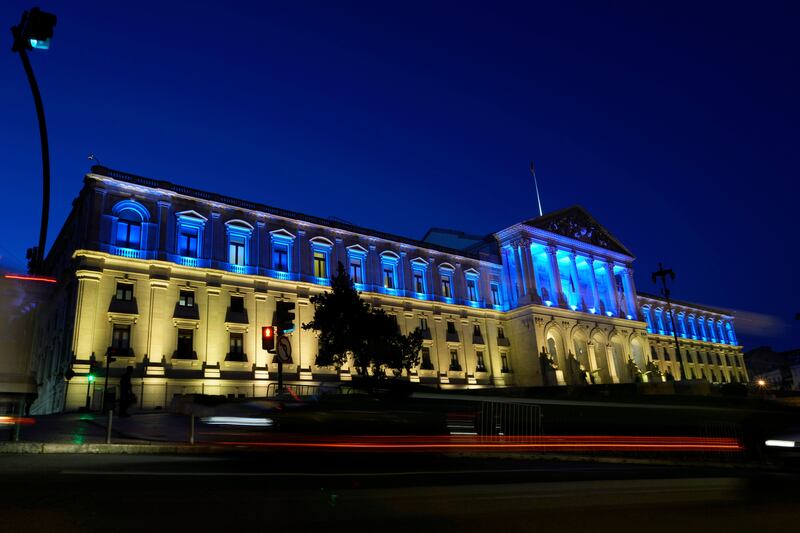 The Portuguese Parliament is lit with the blue and yellow of the Ukrainian flag, in Lisbon AP