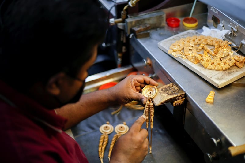 A Devji artisan makes intricate gold jewellery in Hidd. Reuters
