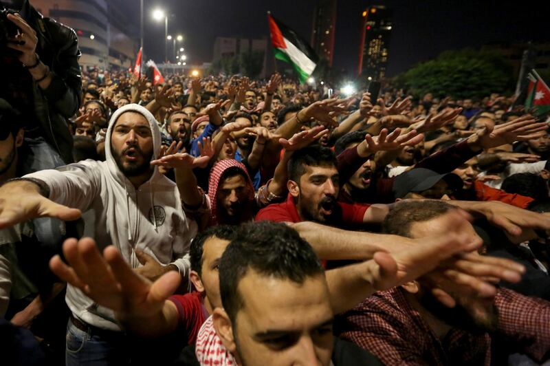 Protesters gather for a demonstration outside the Prime Minister's office in Amman, early Tuesday, June 5, 2018. Jordan's King Abdullah II on Monday accepted the resignation of his embattled prime minister and reportedly tapped a leading reformer as a successor, hoping to quell the largest anti-government protests in recent years, which are also seen as a potential challenge to his two-decade-old rule. (AP Photo/Raad al-Adayleh)