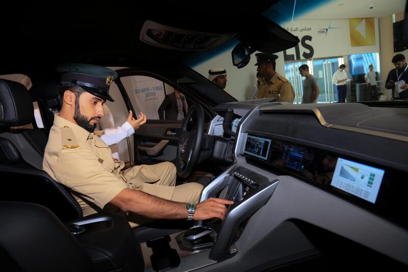 A policeman takes to the driving seat of the Beast Patrol at Gitex. W Motors
