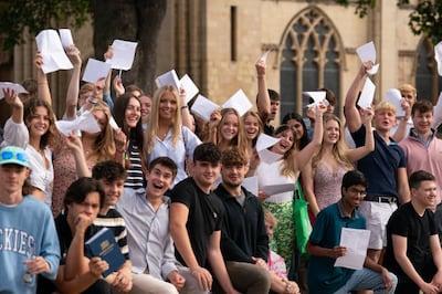 Pupils celebrate their A-level results at Norwich School. PA