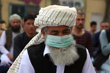 An Afghan Muslim man wearing a face mask as a precaution against coronavirus offers Eid Al Adha prayers in Kabul, Afghanistan, Friday, July 31, 2020. AP