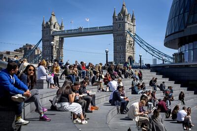 Groups of people enjoy the warm weather near Tower Bridge in central London. Picture date: Thursday April 22, 2021. (Photo by Victoria Jones/PA Images via Getty Images)