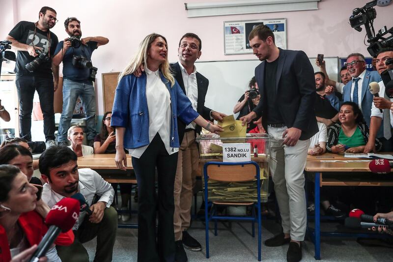 Mr Imamoglu along with his wife Dilek and son Mehmet. Sedat Suna / EPA