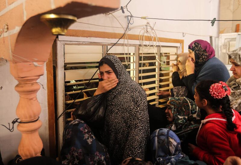 Relatives of Jamal Muslih, who died after being wounded by Israeli fire, during his funeral in central Gaza city on December 30, 2017.
A Gazan died after being wounded by Israeli fire during a protest on the border over US recognition of Jerusalem as Israel's capital, a Palestinian health official said. / AFP PHOTO / MAHMUD HAMS