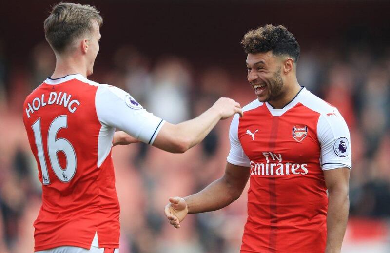 Alex Oxlade-Chamberlain, right, provided both assists in Arsenal's 2-0 win against Manchester United on Sunday. Richard Heathcote / Getty Images