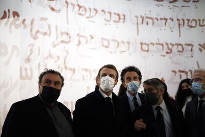 French President Emmanuel Macron, centre, visits the exhibition at the Institut du Monde Arabe in Paris on November 22, ahead of its public opening. AFP