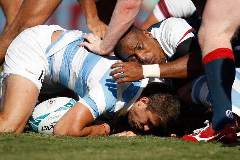 Argentina's centre Juan Cruz Mallia (L) and US wing Marcel Brache fight for the ball during the Japan 2019 Rugby World Cup Pool C match between Argentina and the United States at the Kumagaya Rugby Stadium in Kumagaya. AFP