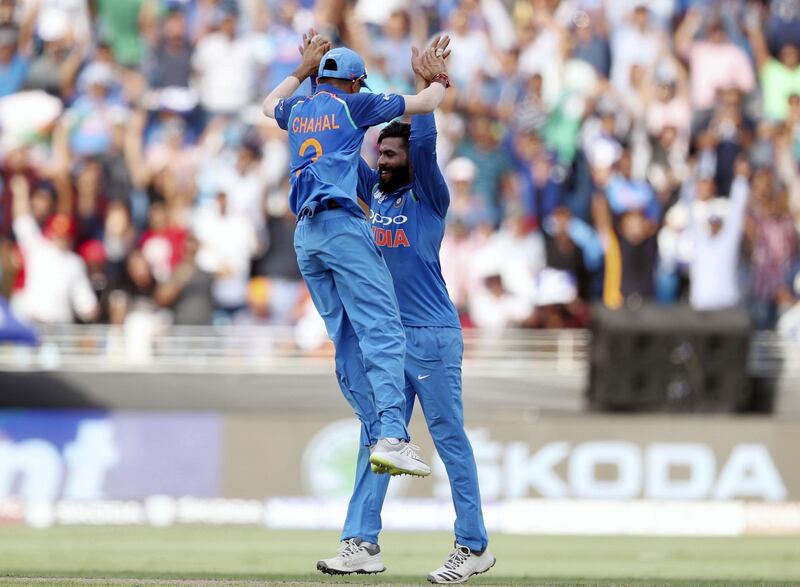 Dubai, United Arab Emirates - September 23, 2018: India's Yuzvendra Chahal (L) celebrates his run out of Pakistan's Babar Azam during the game between India and Pakistan in the Asia cup. Sunday, September 23rd, 2018 at Sports City, Dubai. Chris Whiteoak / The National