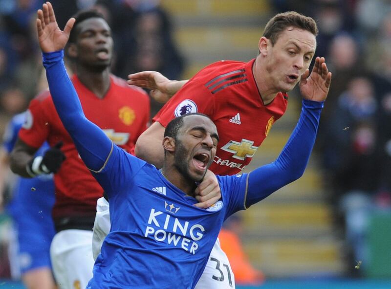Leicester's Ricardo Pereira, left, falls as he challenge for the ball with Manchester United's Nemanja Matic. AP Photo