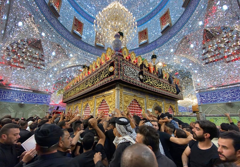 Shiite worshippers visit the holy shrine of Imam Abbas during Ashoura processions in Karbala, Iraq. AP