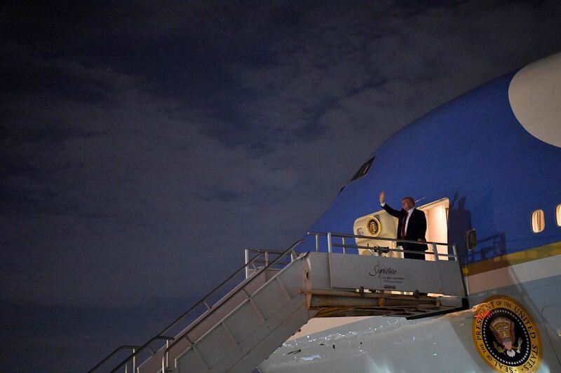 US President Donald Trump steps off Air Force One upon arrival at Miami International Airport in  Miami, Florida.  AFP