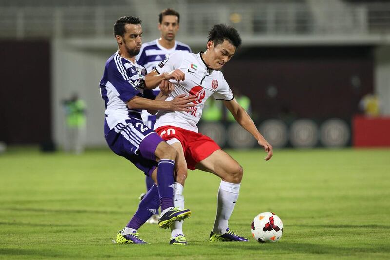Al Ain, in purple, had Al Jazira covered most of the night but Jazira broke through in the final minutes to snatch three points in UAE League Cup play. Mostafa Reda / Al Ittihad