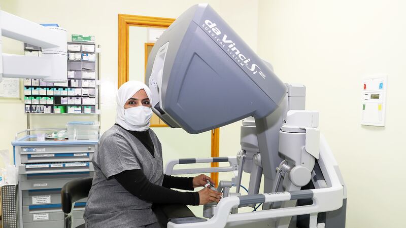 Gynaecologist Dr Mona Kashwani is the first female Emirati doctor to perform an operation using a robotic surgery system, pictured, at Al Qassimi hospital in Sharjah. All photos: Pawan Singh / The National