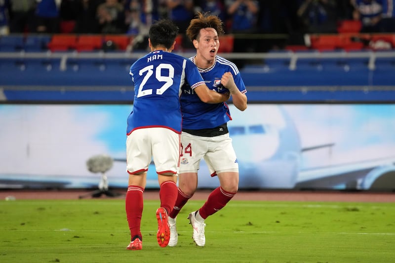 Asahi Uenaka, right, of Yokohama F Marinos celebrates with teammate Nam Tae-hee after scoring their first goal. Getty Images