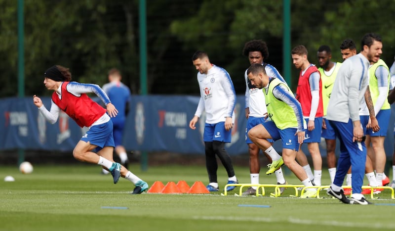 Chelsea's David Luiz, Willian and Eden Hazard with teammates during training. Reuters