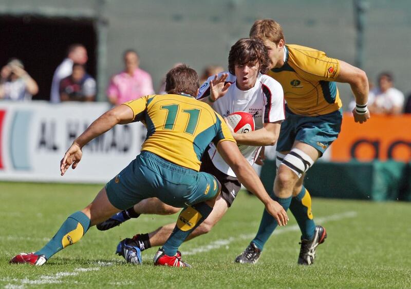 Jonny MacDonald, centre, playing for Arabian Gulf on the first day of the 2009 Emirates Dubai Rugby Sevens. Randi Sokoloff / The National