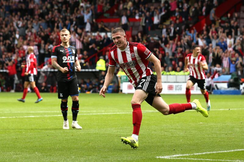 SHEFFIELD, ENGLAND - AUGUST 18: John Lundstram of Sheffield United celebrates after scoring his team's first goal during the Premier League match between Sheffield United and Crystal Palace at Bramall Lane on August 18, 2019 in Sheffield, United Kingdom. (Photo by Jan Kruger/Getty Images)