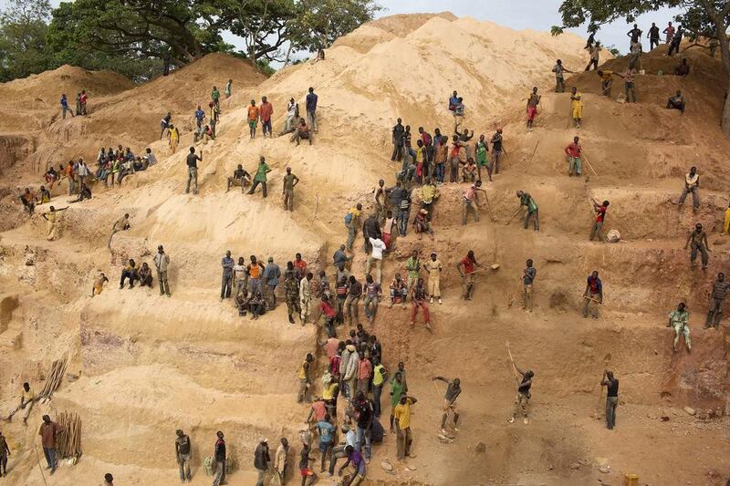 Prospectors work at an open-pit at the Ndassima gold mine. Siegfried Modola / Reuters