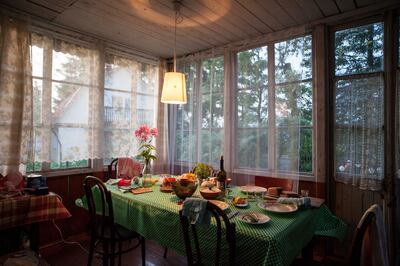 The dining table at Xenia Nikolskaya's family dacha, about 30km outside St Petersburg. The house was built by her grandfather, a retired priest who was a political prisoner under Stalin. After returning from exile he built this summer home as a way of starting over after years of horror.